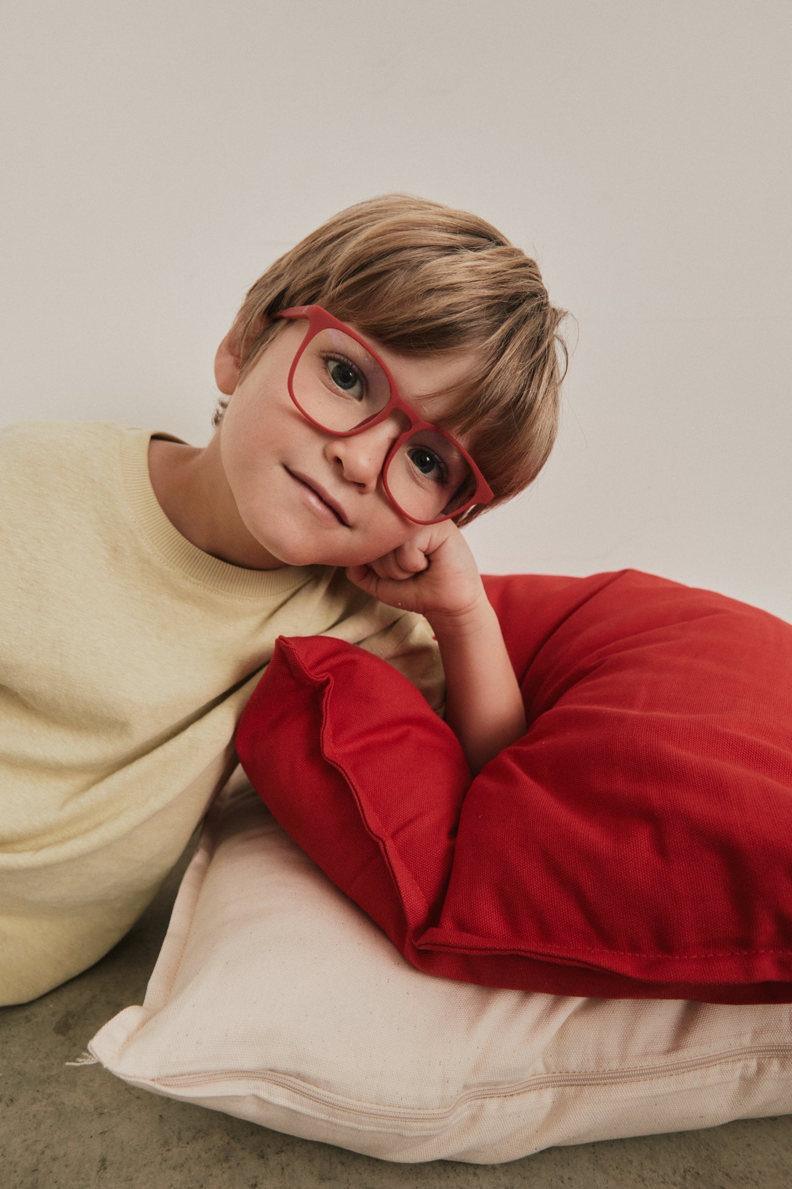 Boy wearing blue light glasses for kids